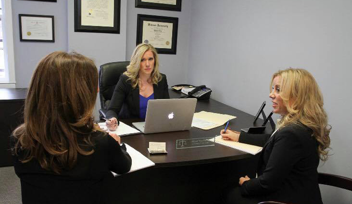 group photo of alissa van horn in a legal meeting with her associates